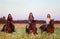 Three beautiful female equestrians in the field