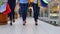 Three beautiful girls with shopping bags goes on