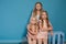 Three beautiful little girls dresses fashion portrait sisters