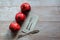 Three beautiful red pomegranates, pomegranates on a tray, pomegranate seeds, a colored napkin, pomegranate seeds