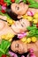 Three beautiful sensual women with colorful tulips