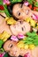 Three beautiful sensual women with colorful tulips