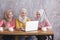 Three beautiful siblings discuss their project at cafe