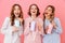 Three beautiful young girls 20s wearing colorful striped pyjamas