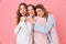 Three beautiful young girls 20s wearing colorful striped pyjamas