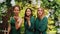 Three beautiful young girls blow a kiss to the camera.