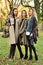 Three beautiful young models in autumn elegant clothes posing at Central Park.