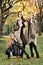 Three beautiful young models in autumn elegant clothes posing at Central Park.