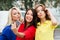 Three beautiful young women posing and grimacing