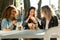 Three beautiful young women visiting eat market in the street.