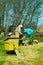 Three beekeepers work on an apiary at hive. Sunny day.