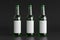 Three beer bottles 500ml mock up with blank label on black background