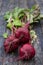 Three beetroot on the wooden table