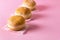 Three Berliner Doughnuts European Donuts Tradicional Bakery for Fasching Carneval Time Horizontal Pink Background