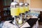 Three beverage dispensers with lemonade standing on the table