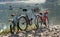 Three bicycles on a beach.