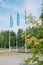 Three BILTEM flags fluttering in wind at entrance of Swedish store of spare parts, household goods on natural background