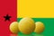 Three Bitcoins cryptocurrency with Guinea Bissau flag on background