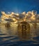 Three bitcoins rising out of water to show the price rise in the cybercurrency