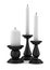 Three black candlesticks with candles isolated