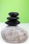 Three black stones stacked on top of each other