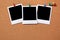 Three blank polaroid frame photo print pushpin cork background