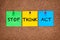 Three blanks post-it notes on corkboard with words Stop, Think, Act