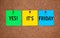 Three blanks post-it notes on corkboard with words Yes! Its Frid