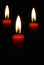 Three blazing red candles