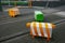 Three blocky animal sculptures. Colorful sheep traffic safety bollards on road with tramway tracks in Christchurch, New Zealand