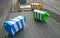 Three blocky animal sculptures. Colorful sheep traffic safety bollards on stone pedestrian sidewalk in Christchurch, New Zealand