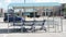 three blue shopping grocery carts outside outdoors in summer loosely inside each