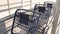 three blue shopping grocery carts outside outdoors in summer loosely inside each