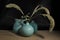 Three blue vases still life on wooden table