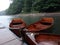 Three boats are anchored at the mooring in rainy weather.