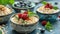 Three bowls of rice pudding with fruit toppings and mint