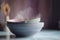 three bowls with spoons on a table with a blurry background