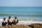 Three boys on breakwater