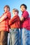 Three boys standing arms crossed