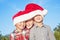 Three boys wearing Santa hat