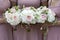 Three bridesmaids holding wedding bouquet