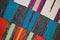 Three bright textile striped rugs with lilac, blue, red and white stripes. Textile texture