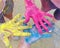 Three brightly colored hands together.