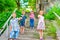 Three brothers and sister stand on the steps in the park and show the class