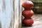 Three brown clay pots arranged one by one in a straight manner