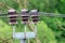 Three brown insulators with wires