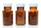Three Brown Medicine Bottles With Different Drugs