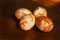 Three brown unique hand-painted Easter eggs on the table