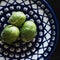 Three Brussels sprouts on polish pottery