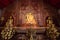 Three Buddha images sitting inside Wat Phra Singh, Thailand